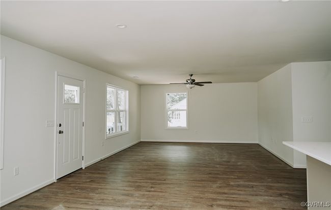 Entrance foyer featuring ceiling fan and dark hardwood / wood-style floors | Image 7