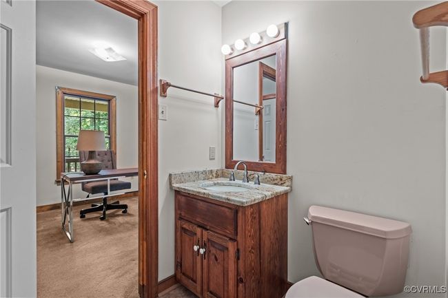 Bathroom featuring vanity and toilet | Image 14
