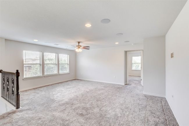 Carpeted spare room featuring a ceiling fan, recessed lighting, and baseboards | Image 19