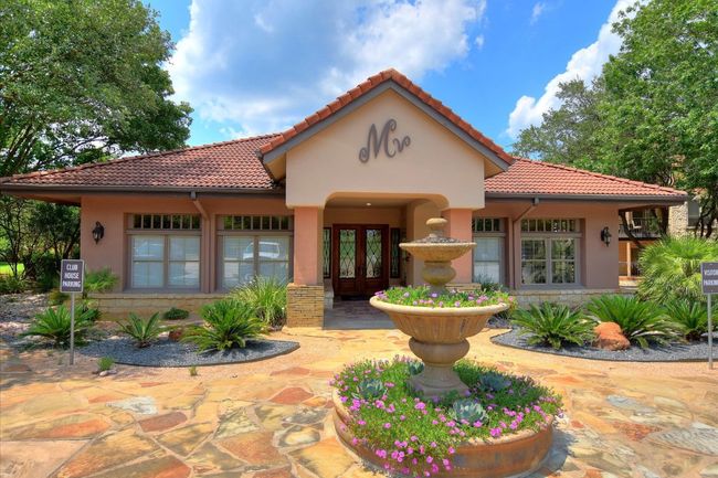 View of front facade featuring french doors, a tiled roof, and stucco siding | Image 12