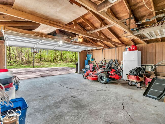 garage featuring a garage door opener | Image 23