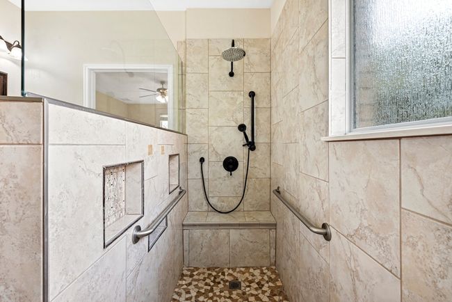 Full bathroom with a walk in shower and ceiling fan | Image 31