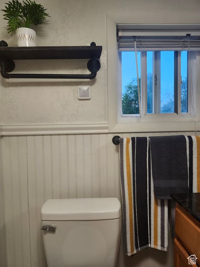 Bathroom featuring toilet and wainscoting | Image 17
