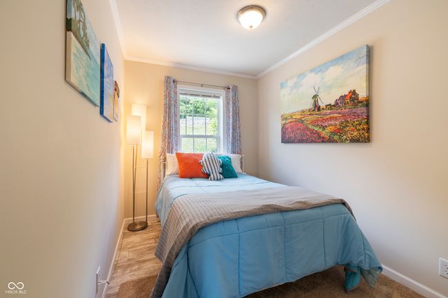 bedroom with baseboards and ornamental molding | Image 19