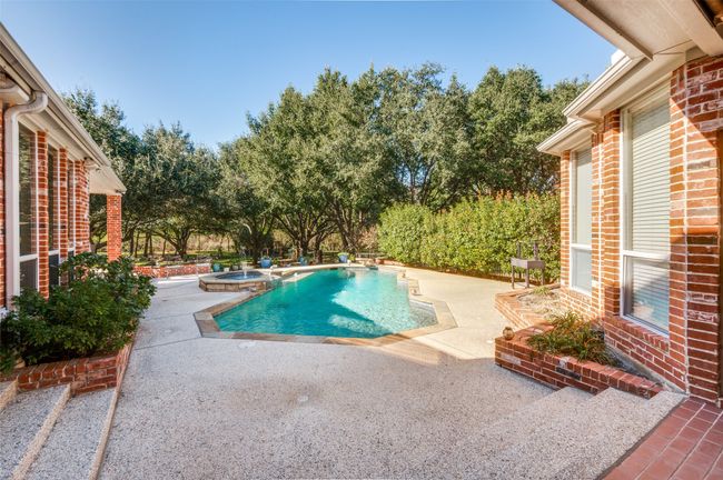 View of pool featuring a patio and a pool with connected hot tub | Image 30