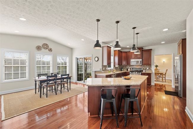 Whirlpool stainless steel dishwasher, 5 burner gas stove and microwave are appreciated. | Image 11