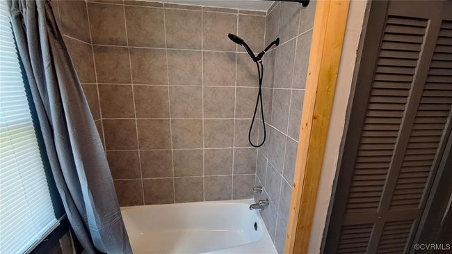 Full bathroom featuring shower / bath combo | Image 23