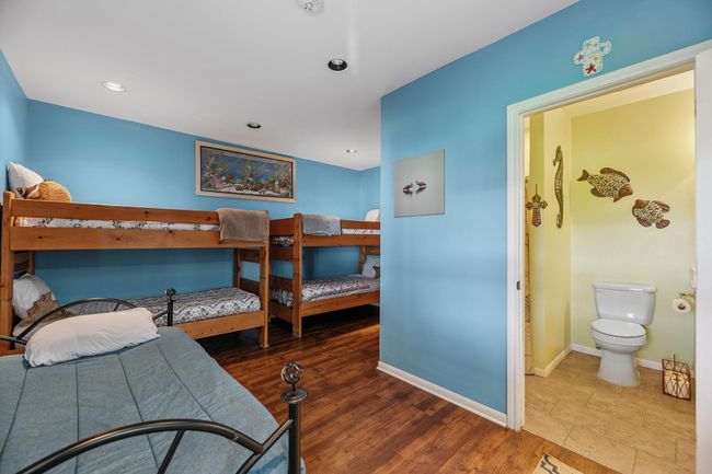 Downstairs large bunkroom with full bathroom | Image 12