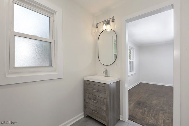 Bathroom with plenty of natural light, vanity, and wood-type flooring | Image 26