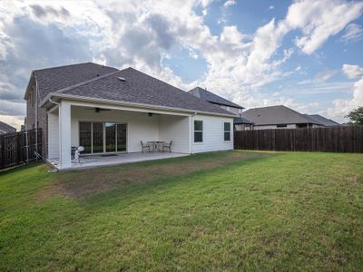 Back of house with a patio area, ceiling fan, and a yard | Image 3