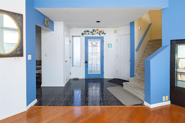 Entryway featuring a healthy amount of sunlight and tile flooring, coat closet. | Image 7