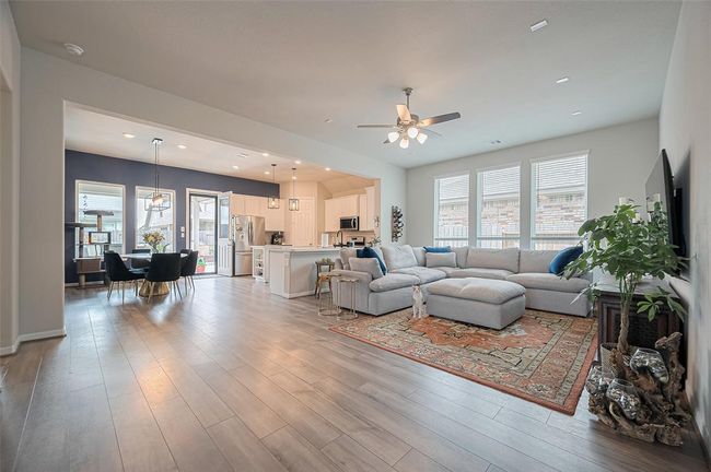 Open plan living with luxury vinyl tile throughout main living areas. | Image 16
