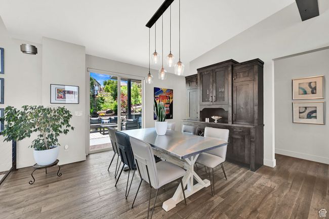 Dining space featuring wood finished floors, lofted ceiling, and baseboards | Image 27