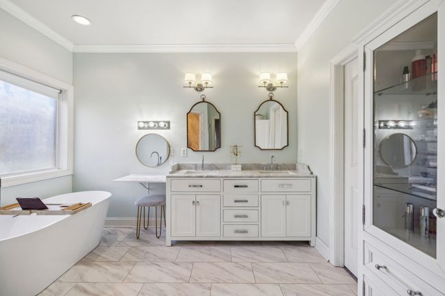 The primary bath is the perfect calm oasis for the hardworking homeowners. | Image 29