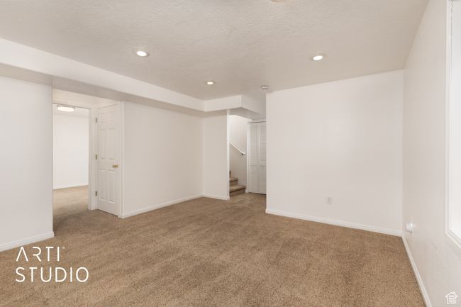 Spare room with carpet floors, stairway, and recessed lighting | Image 18