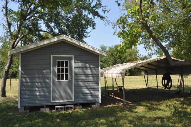 View of outbuilding with a yard and a carport | Image 13