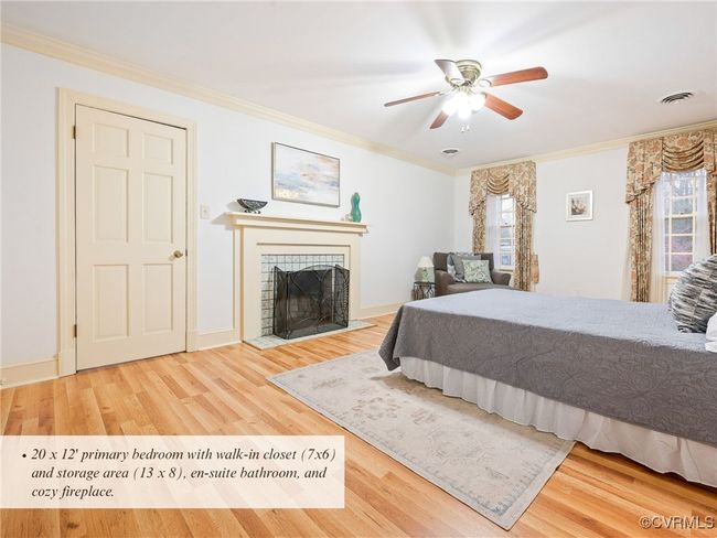 20 x 12' primary bedroom with walk-in closet (7x6) and storage area (13 x 8), en-suite bathroom, and cozy fireplace. | Image 30