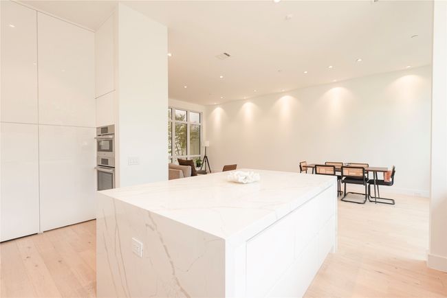 View from kitchen to dining area. | Image 11