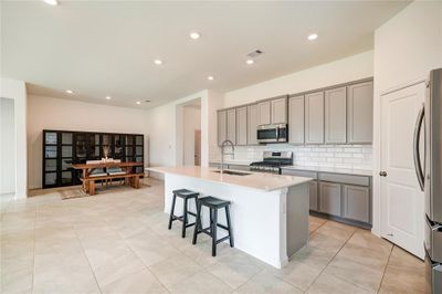 Another view of the kitchen and formal living room. | Image 3