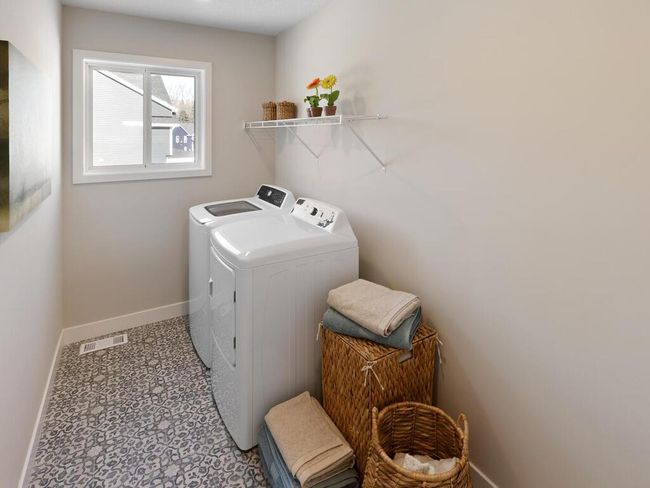 The convenient 10x6 laundry room on the upper level makes everyday chores a breeze, offering plenty of space for folding, organizing, and storing, all while keeping everything close to the bedrooms. | Image 32