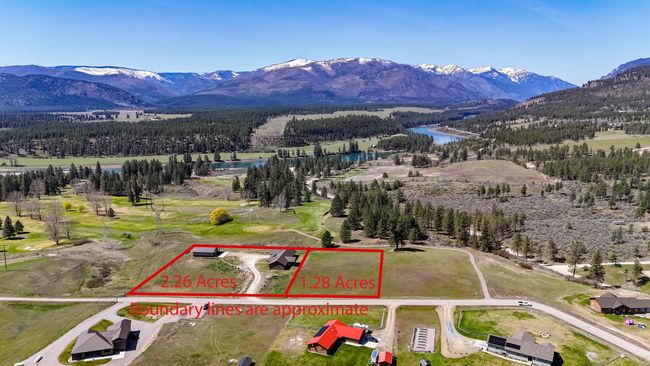 Birds eye view of property featuring a water and mountain view and a view of trees | Image 34