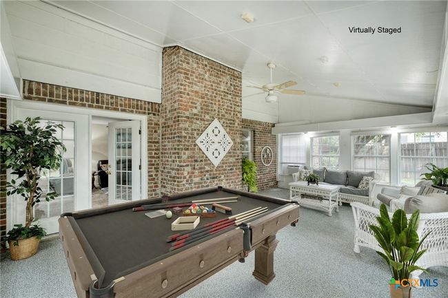 Sunroom Virtually staged with pool table to show all the possibilities for this room. | Image 26