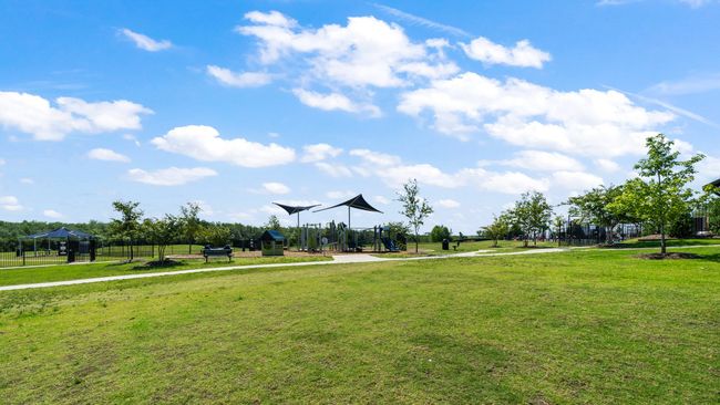 View of property's community with a lawn | Image 31