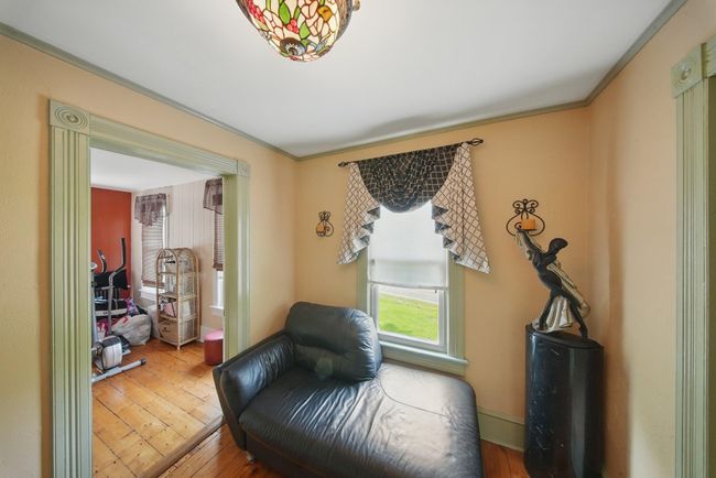 Living area featuring hardwood / wood-style flooring and ornamental molding | Image 29
