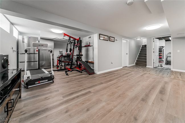 Exercise room featuring baseboards and wood finished floors | Image 31