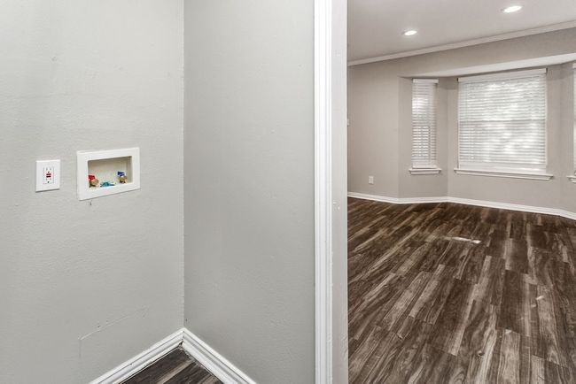 Laundry room featuring hookup for a washing machine, dark wood-style floors, recessed lighting, and crown molding | Image 11