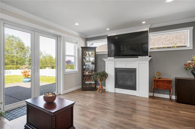 French doors lead to the gorgeous backyard and patio | Image 19