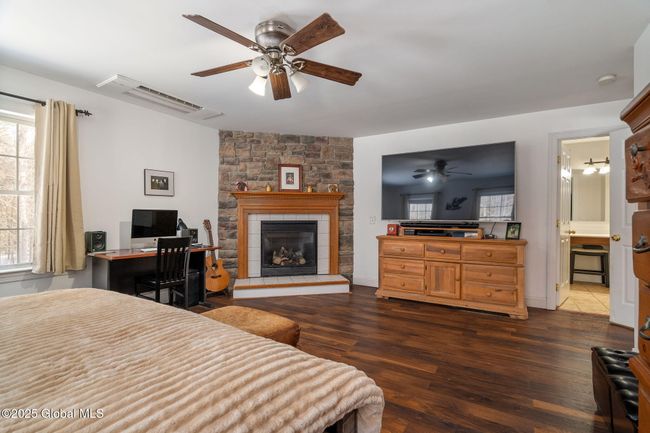 Primary en-suite featuring gas fireplace with blower | Image 23