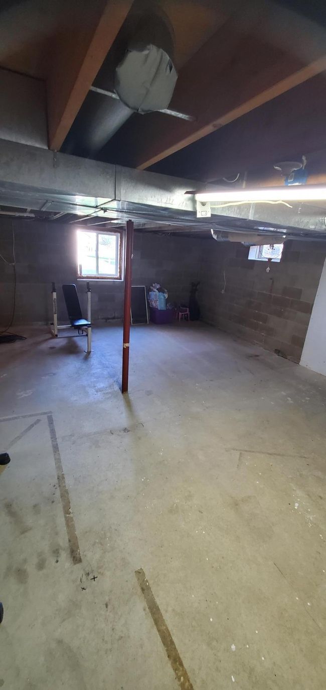 unfinished basement, plumbed for future bath | Image 16