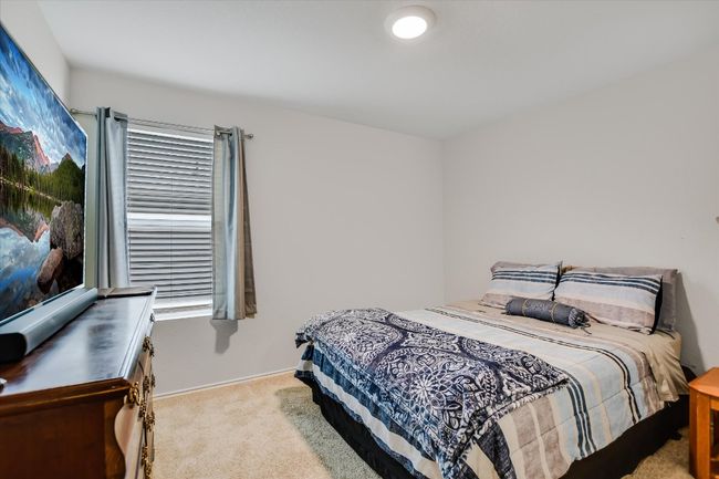 Bedroom featuring carpet floors and baseboards | Image 16