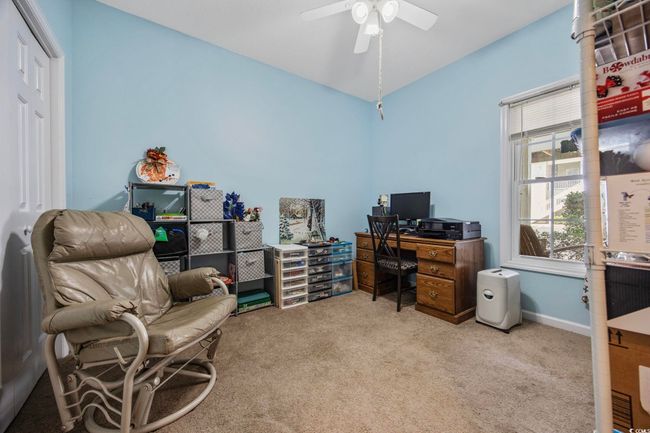 Office with carpet floors, a ceiling fan, and vaulted ceiling | Image 16