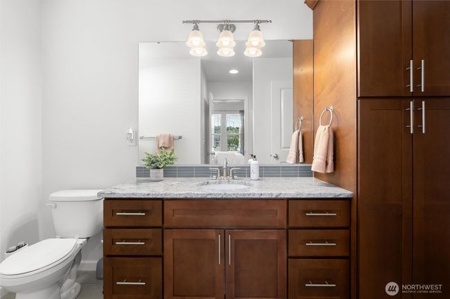 Spacious main floor 3/4 bathroom with walk-in shower & ample storage! | Image 16