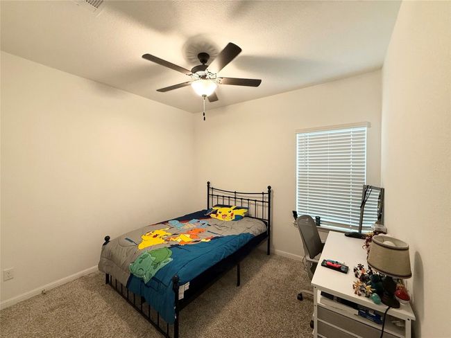 Carpeted bedroom featuring baseboards and ceiling fan | Image 20