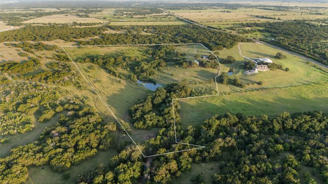 Aerial overview of property's location with rural landscape and property parcel outlined | Image 30