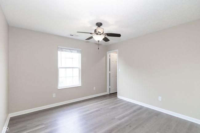 unfurnished room featuring wood finished floors and a ceiling fan | Image 25