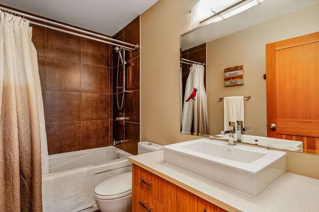 Full bathroom featuring vanity and shower / bath combo with shower curtain | Image 27
