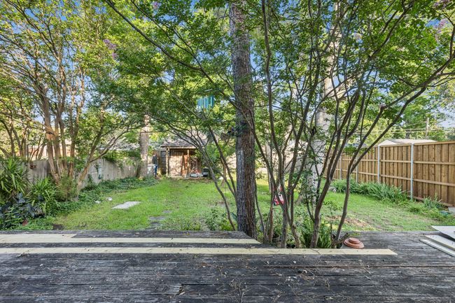 View of yard featuring a wooden deck | Image 26