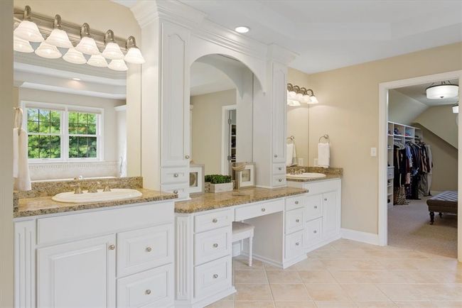 Beautiful moldings enhance the vanity area. | Image 27