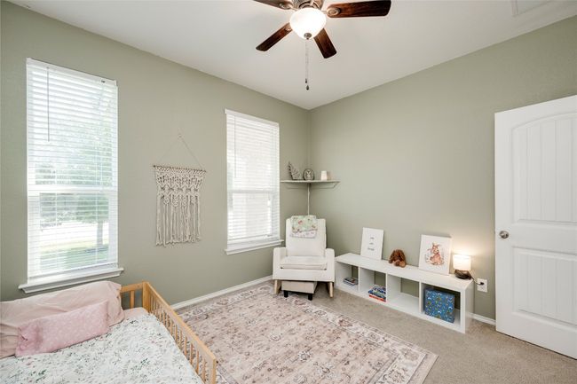 Bedroom with carpet and a ceiling fan | Image 21