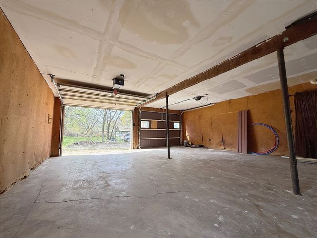Garage with a garage door opener | Image 18