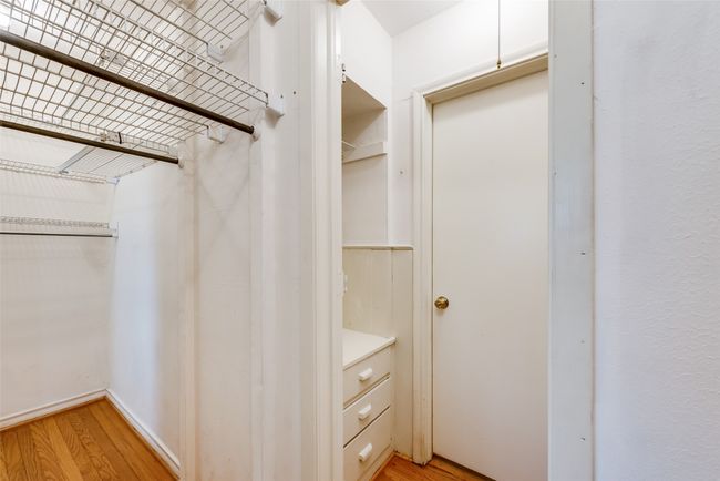 Walk in closet with light wood finished floors | Image 20