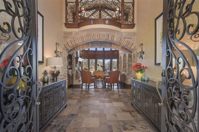 Elegant iron accents are thoughout this home | Image 11