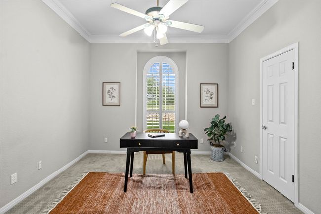 Staged as an office, this bedroom is on the main floor and has a generous sized closet and ensuite bathroom | Image 20