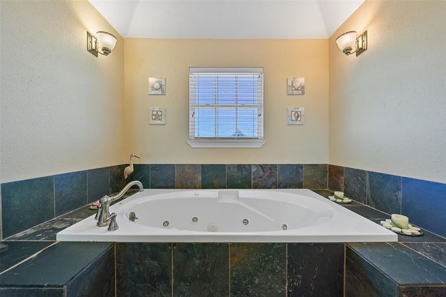 Primary bath with a spacious jetted soaking tub. | Image 22