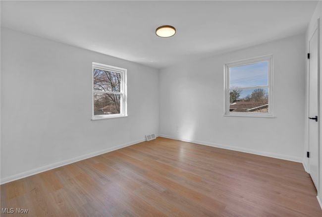 Unfurnished room with light wood-type flooring, baseboards, and visible vents | Image 18