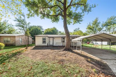 View of front of house featuring a front lawn and a carport | Image 2